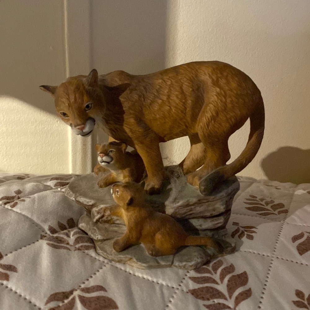 Porcelain mountain lion figurine.